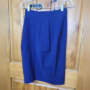 No brand or size tag on this purple wool skirt see measurements